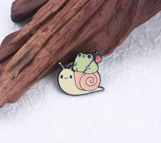 Frog on the snail badge